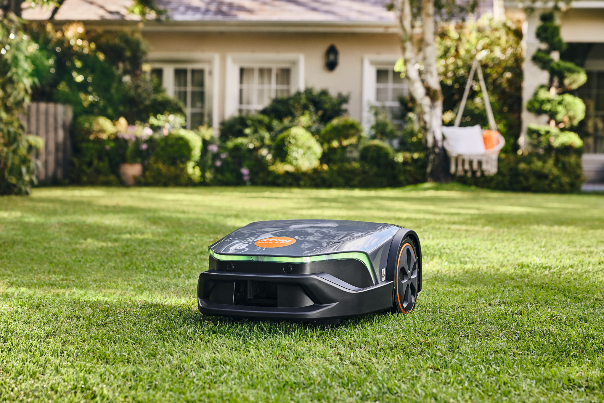 A STIHL iMOW® robot mower in a garden