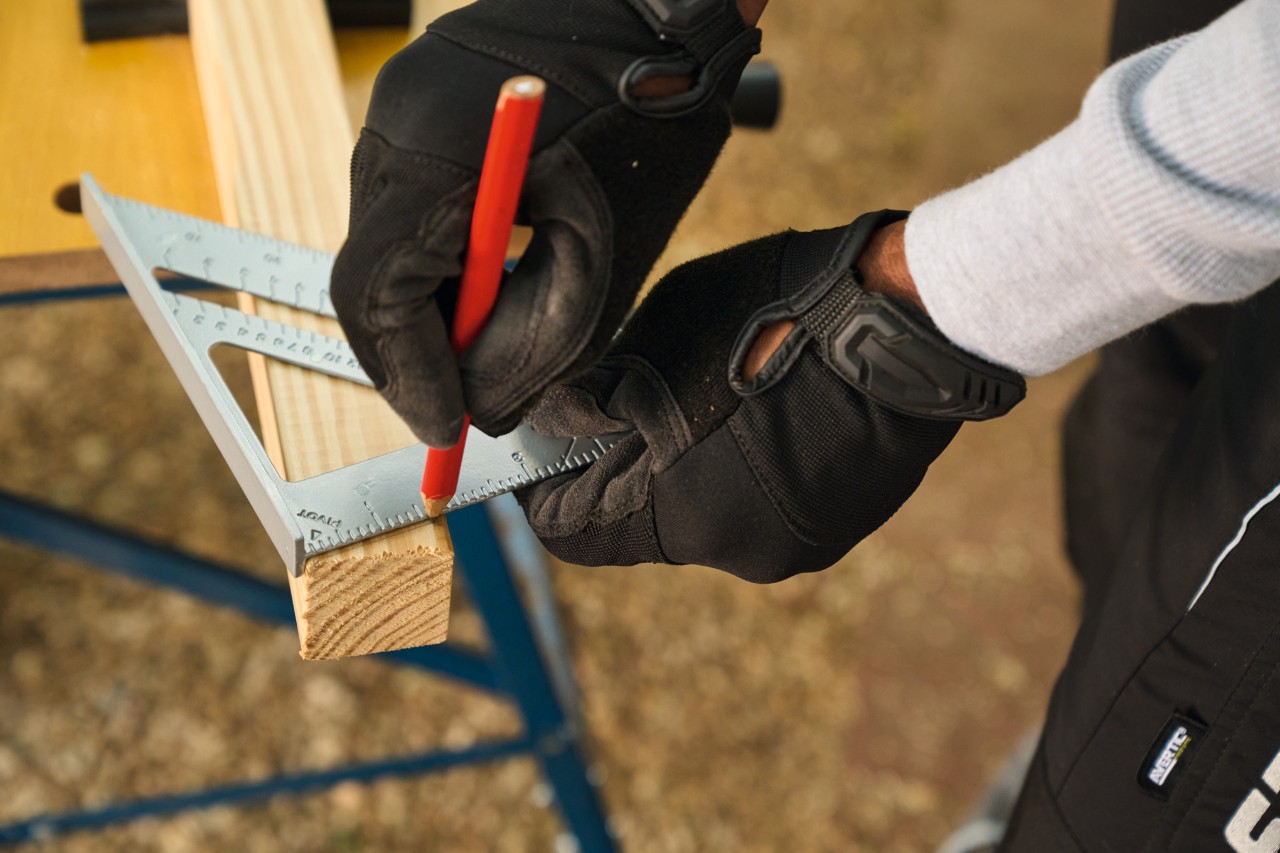 A set square is used to mark angles on the side struts