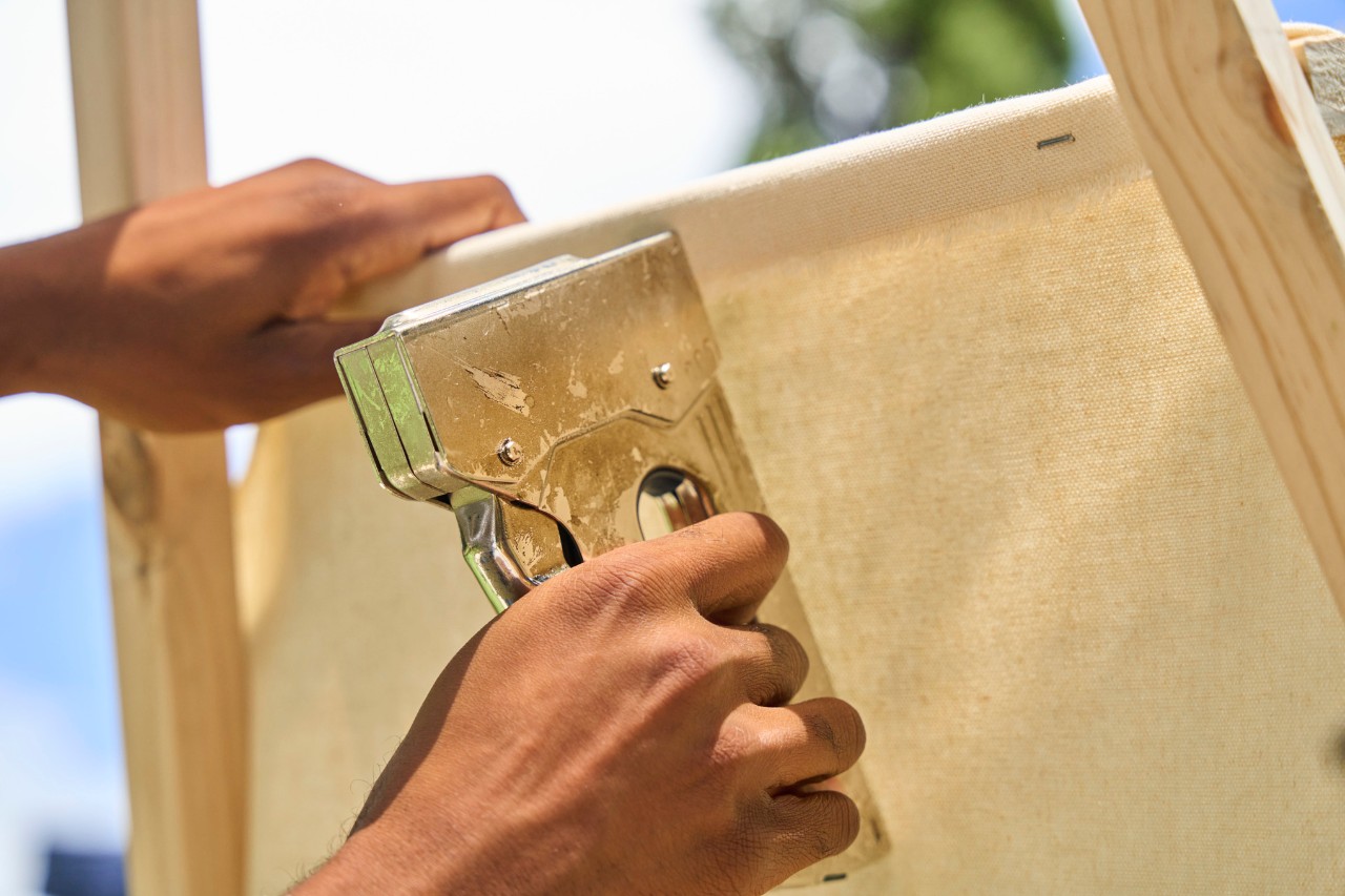Stapling fabric to wood to create the entrance