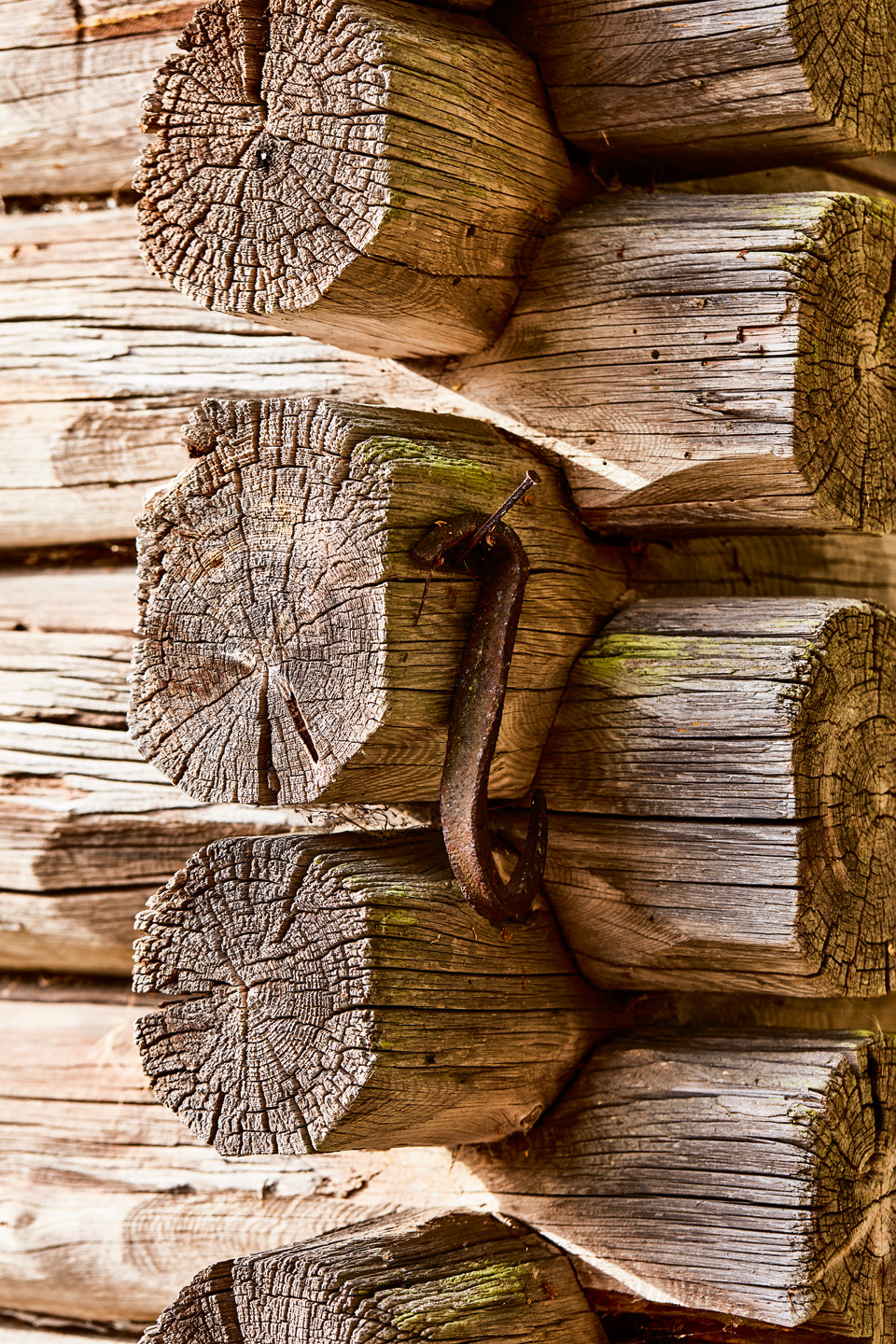 Close-up of weathered log walls meeting at a corner