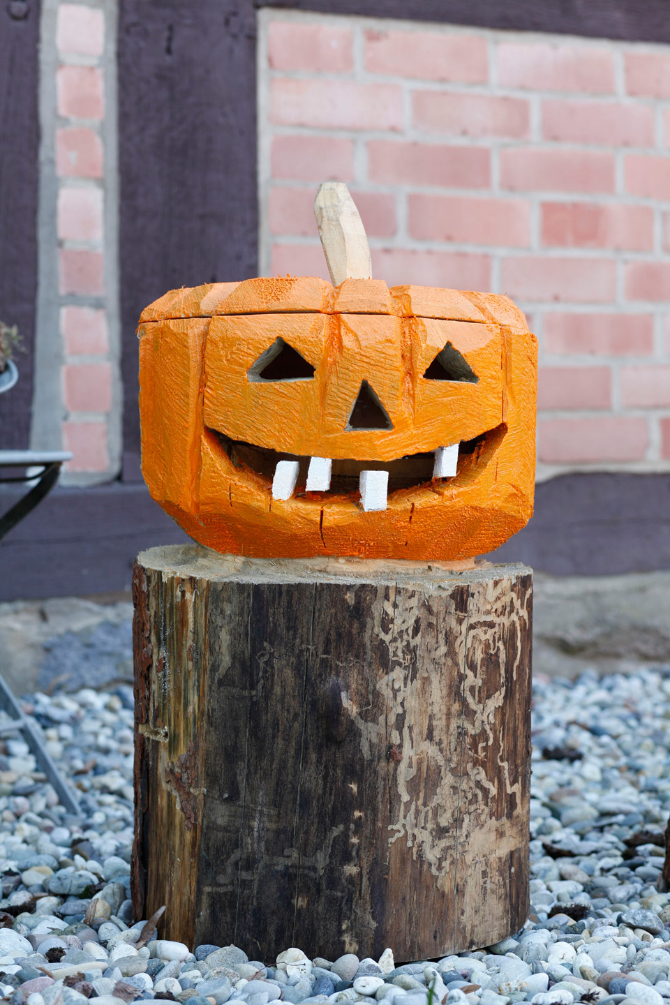 A painted wooden jack o’lantern decoration