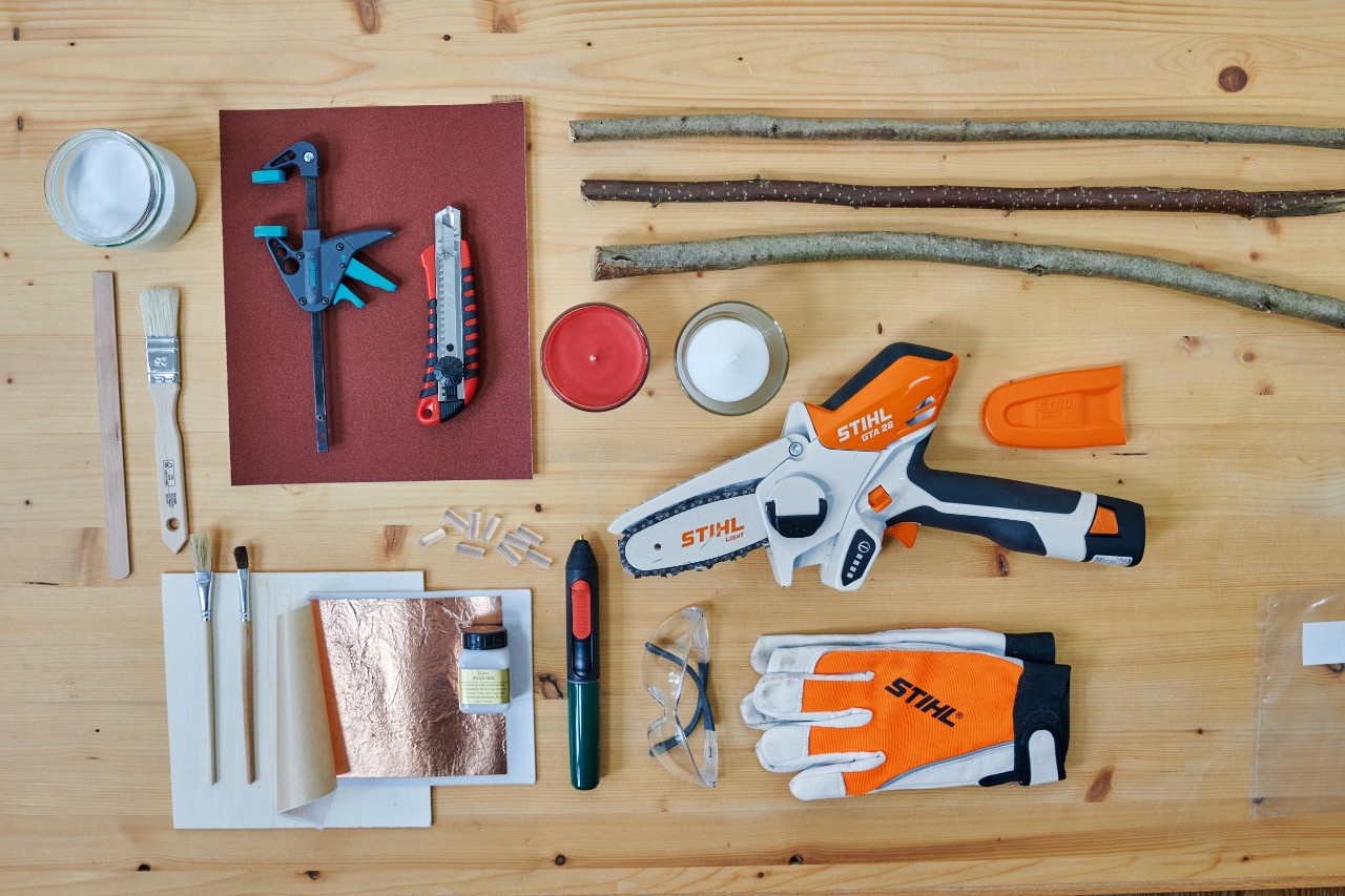 Photo from above of all materials and equipment needed to make a DIY advent wreath