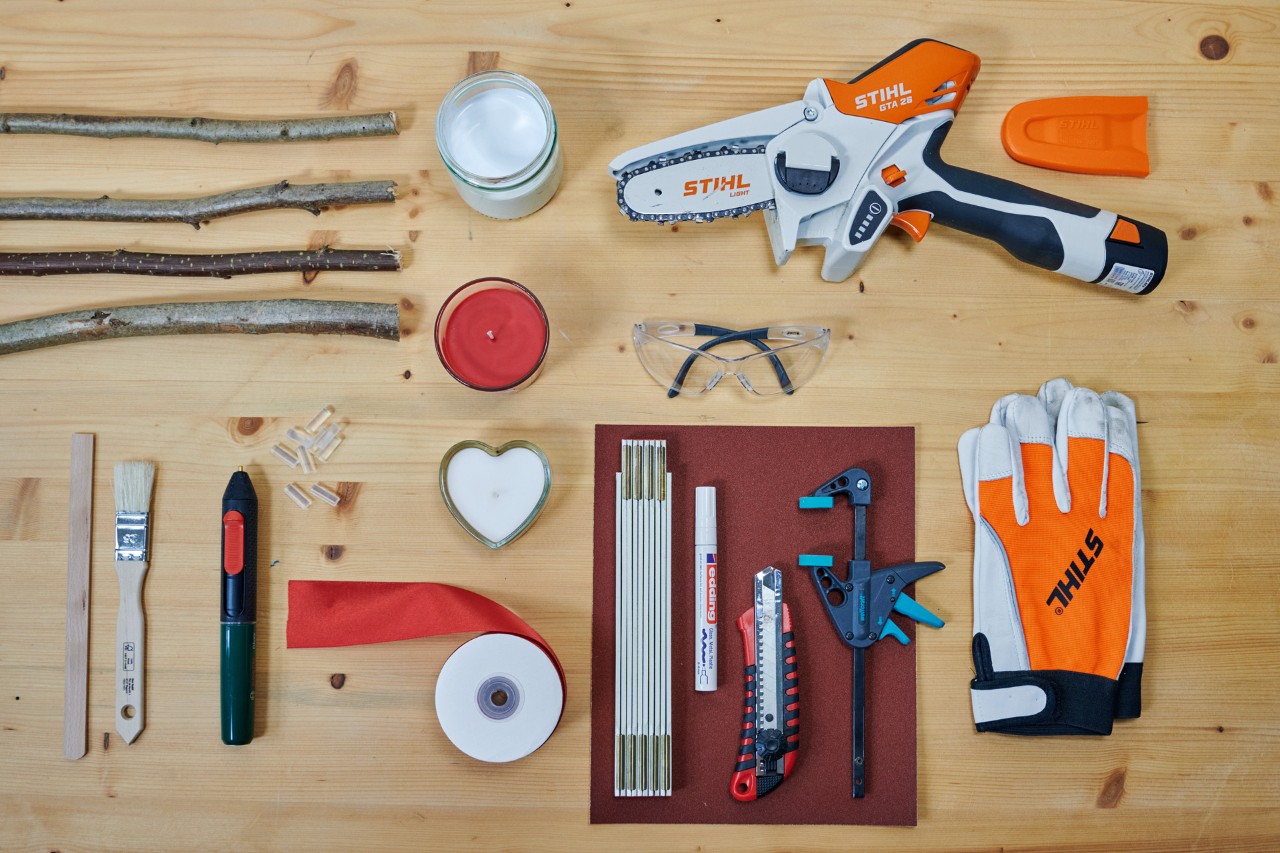 All materials needed to make a DIY branch heart, including a STIHL GTA 26 garden pruner.