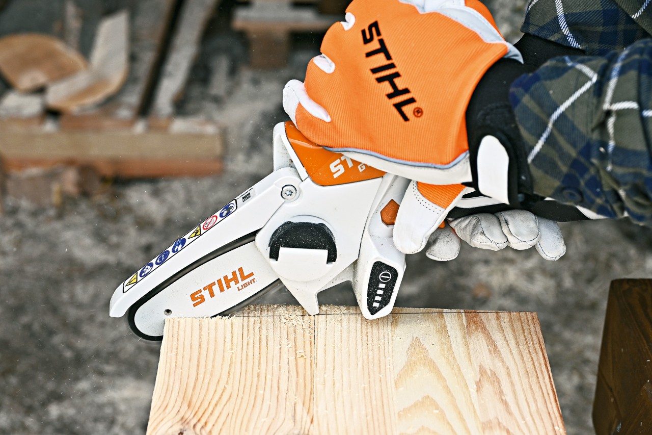 A STIHL GTA 26 cordless garden pruner is used to cut angled edges for the side of the hedgehog house