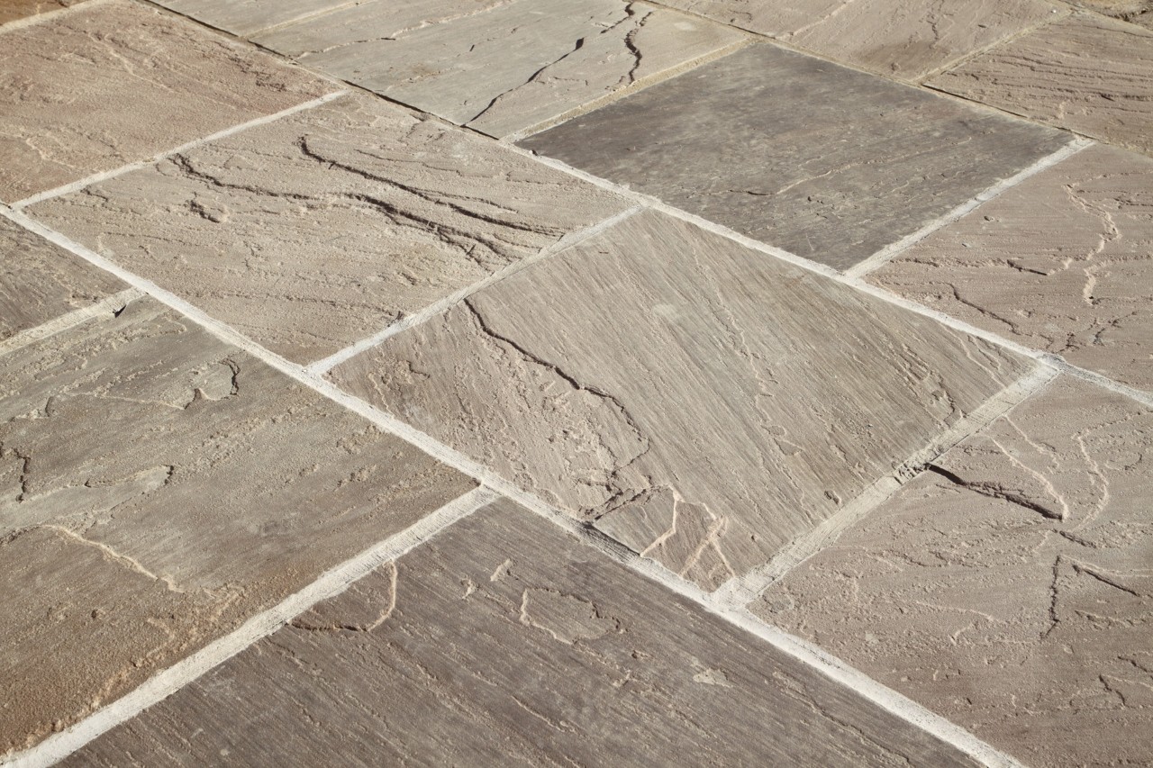 Close-up of a floor laid with natural stone tiles