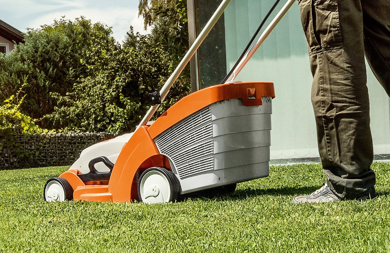 A STIHL RMA 339 cordless lawn mower cutting the grass
