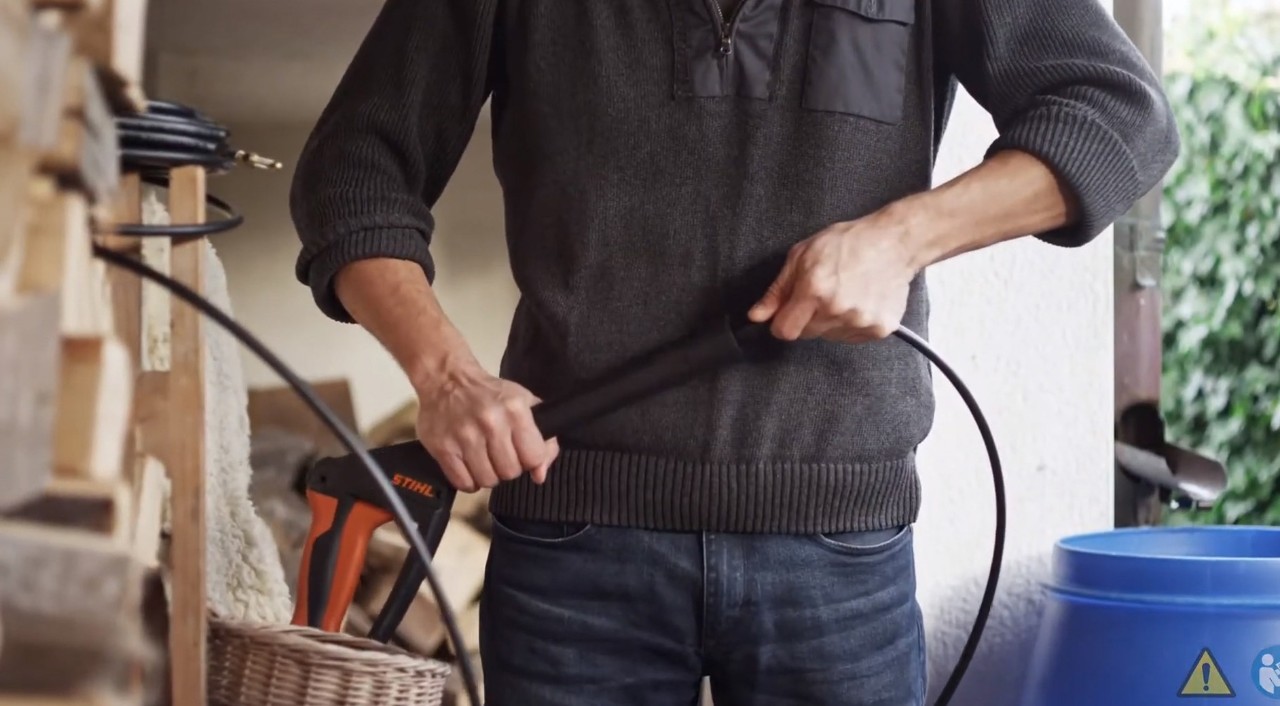 A pipe cleaning set being attached to a STIHL high-pressure cleaner