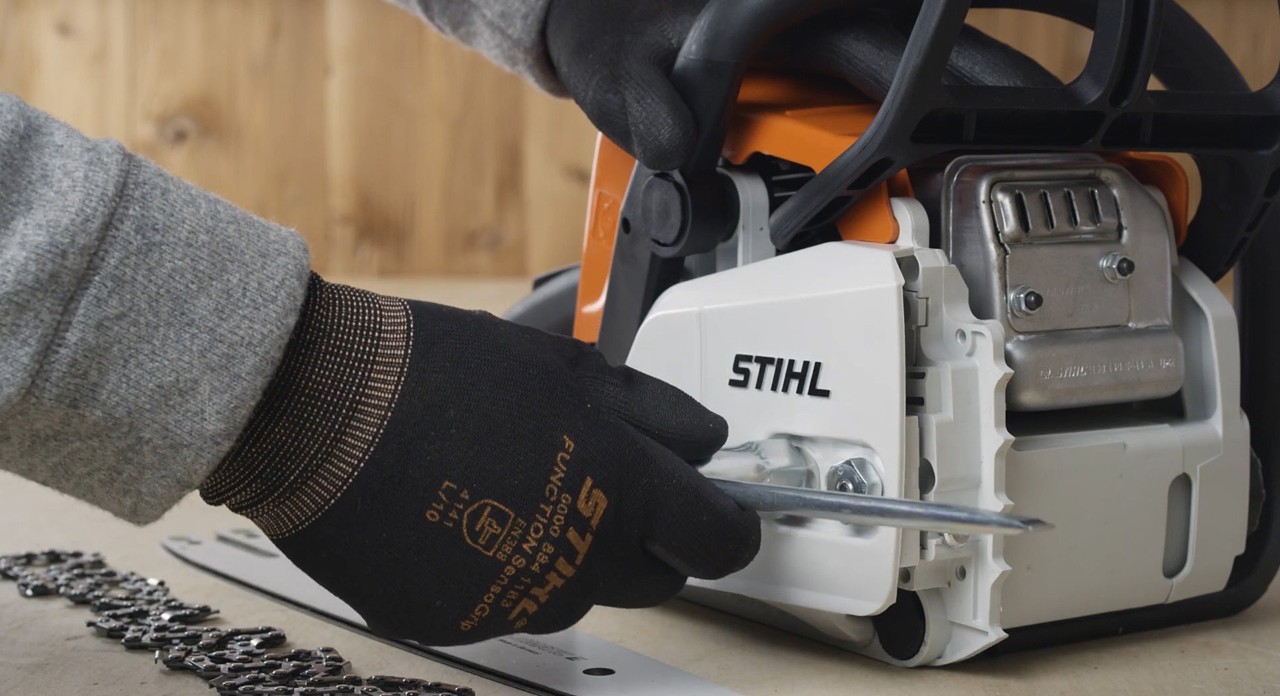 Close-up of the chain sprocket cover on a STIHL MS 170 cordless chainsaw