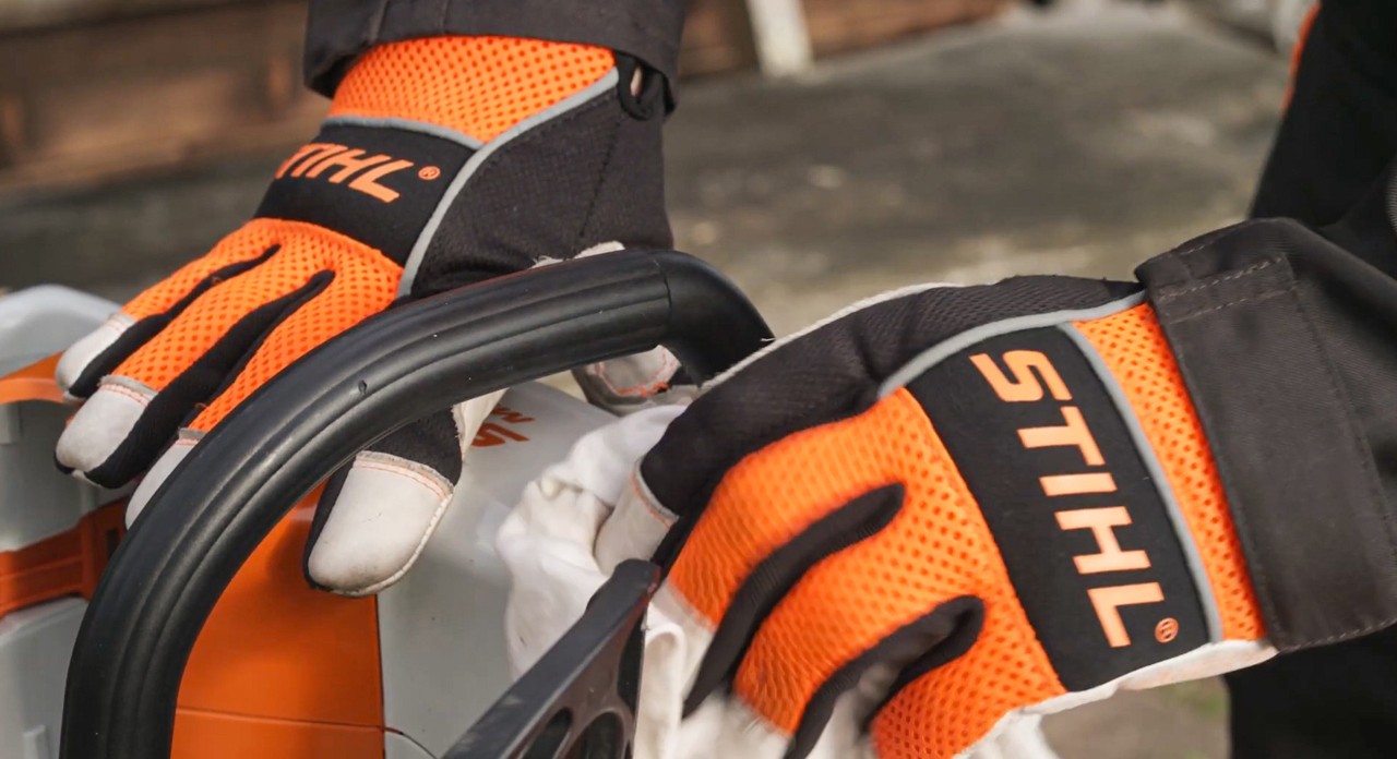 Close-up of a STIHL MSA 120 cordless chainsaw oil tank cap