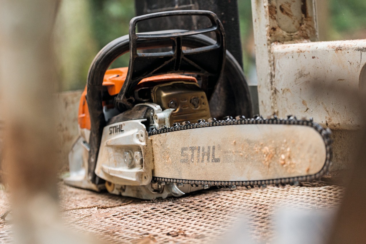 A STIHL MS 261 looking worn on the ground