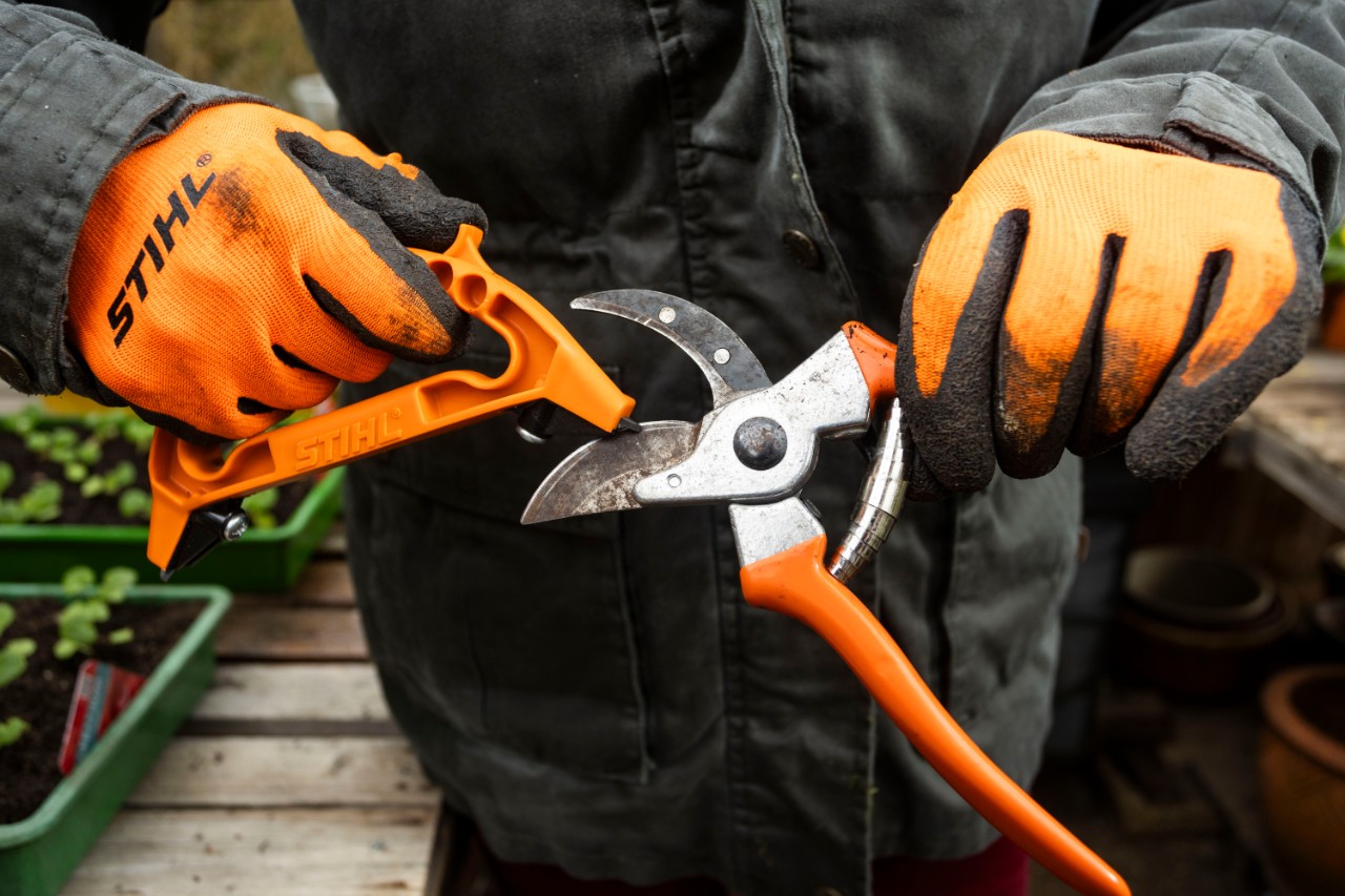 using 3-in-1 sharpening tool to sharpen PG 10 secateurs