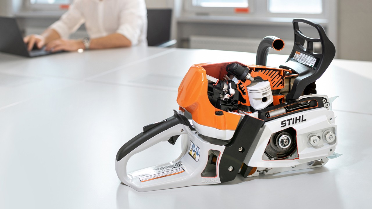 A STIHL MS 400 C-M petrol chainsaw with guide bar removed and piston exposed