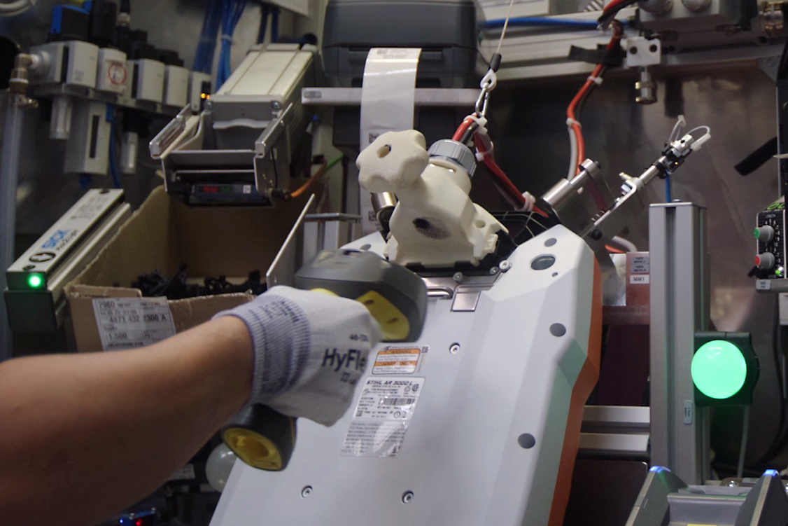 One person performs an end-of-line test and checks the battery's functionality